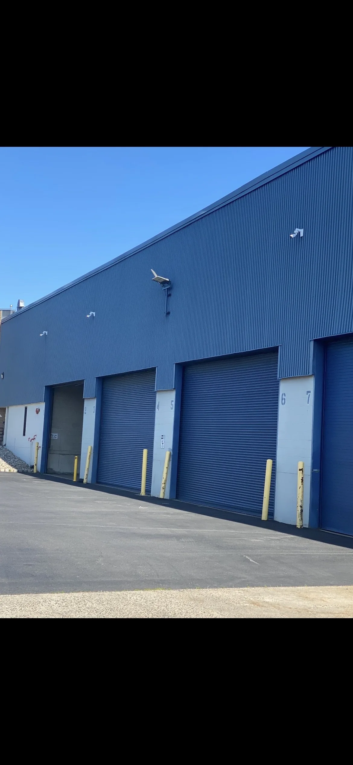 Outdoor security cameras installed on an Edison NJ warehouse
